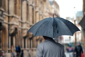 man holding umbrella