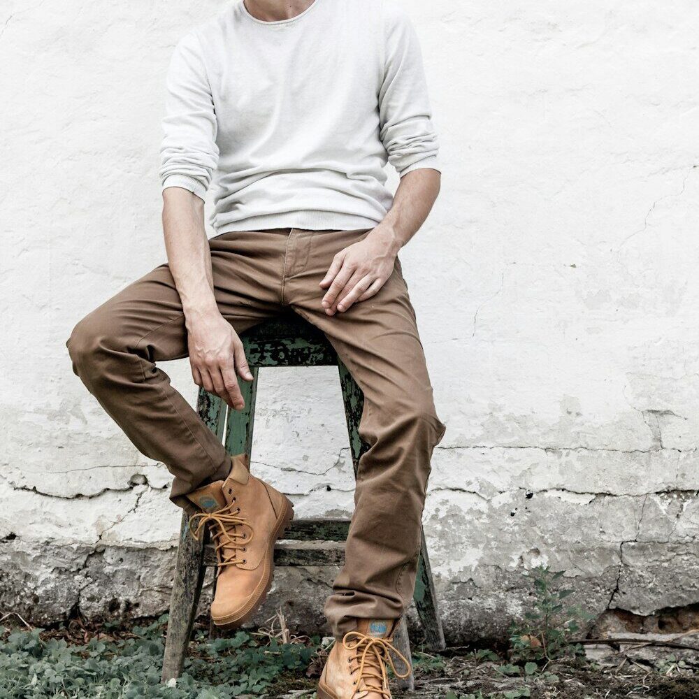 man sitting on stool